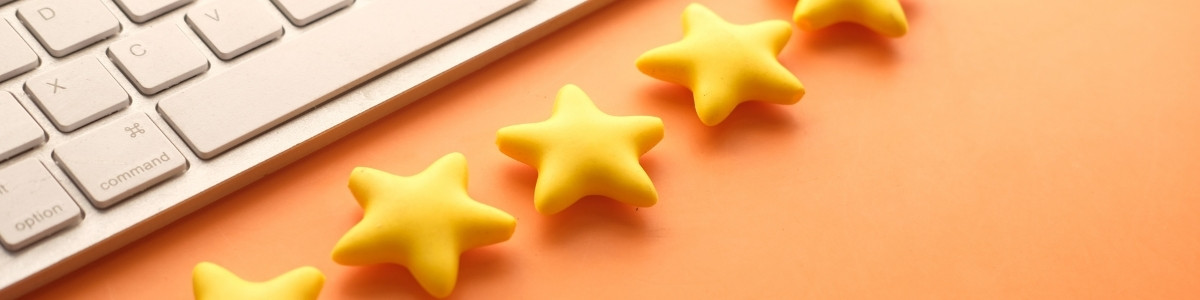 Five stars and keyboard on an orange background