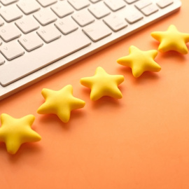 Five stars and keyboard on an orange background